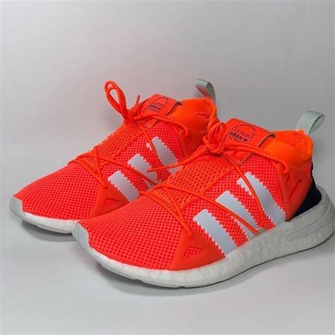 blue and orange shoes|bright orange adidas shoes.